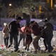 People carry a peson at the Route 91 Harvest country music festival after apparent gun fire was heard on October 1, 2017 in Las Vegas, Nevada. (Photo by David Becker/Getty Images)